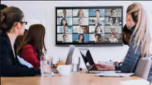 Office workers using Zoom Video Conferencing