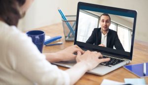 Woman using video conferencing to recruit new hires